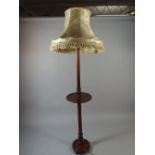 A Turned Mahogany Standard Lamp with Shade