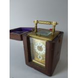 A Pretty French Brass Cased Carriage Clock with Gilt Front Panel and Enamelled Chapter Ring and