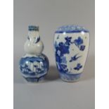 An Oriental Vase of Double Gourd Form decorated in Blue and White Enamel together with Another with