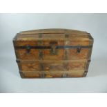 A Vintage Dome Topped Travelling Trunk with Tooled Leather Covering having Iron and Wooden Mounts.