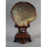 An Oriental Carved Mother of Pearl Shell decorated with Bird and Blossom on Carved and Pierced