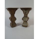 A Pair of Chinese Gu Shaped Bronze Altar Vases with Embossed Decoration.