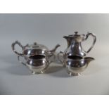 An Edwardian Walker and Hall Four Piece Silver Plated Tea Service.