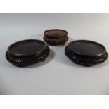 A Pair of Pierced Hardwood Circular Stands, 16cm Diameter. Together with a Single Example.