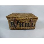 A Large Vintage Wicker Laundry Basket with Leather Straps Stencilled "Criterion" and "B'hill"