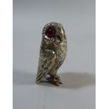 An Edwardian Silver Novelty Pepper Pot in the Form of an Owl with Original Red Glass Eyes.