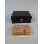 A Gilt Silver Trinket Box with Stone Mount having Fossil Inclusions. with Original Box. London 2003.