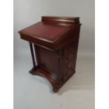 A Reproduction Mahogany Davenport with Tooled Leather Writing Surface and Four Side Drawers