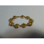 A 9ct Yellow Gold and Citrine Bracelet.