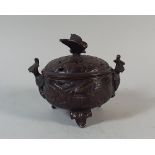 An Oriental Bronze Koro of Squat Proportions and on Three Stylised Vine Leaf Feet.