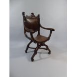 A 19th Century Mahogany X Frame Armchair with Carved Lion Mask Finials and Leather Upholstered Seat