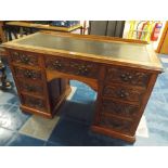 A Late 19th Century Carved Mahogany Kneehole Writing Desk with Rexine Top Having Centre Drawer