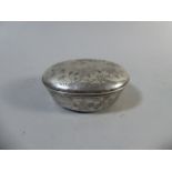 An Early Continental Silver Oval White Metal Lidded Box with Foliate, Bird and Insect Decoration.