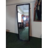 An Early 20th Century Gentlemans Outfitters Mirror in an Ebonised Wooden Frame.