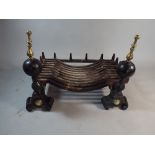 A Pair of 19th Century Brass Mounted Cast Iron Fire Dogs and Cast Iron Fire Basket