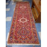 A Patterned Persian Woollen Runner.