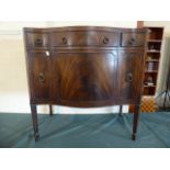 An Edwardian Mahogany Serpentine Fronted Side Cabinet with One Long and Two Short Drawers over Two