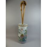 An Oriental Ceramic Stick Stand Containing Two Walking Sticks