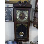 A Modern Mahogany Framed Wall Clock with Quartz Movement