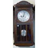 An Edwardian Oak Wall Clock,