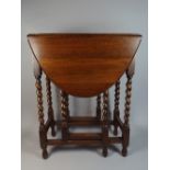 A Small Oak Gate Legged Table with Barley Twist Supports,