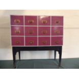 A Painted Chest of Twelve Drawers on Stand 101cm Wide