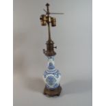 An Early 20th Century French Blue and White Ceramic Table Lamp with Brass Mounts,