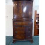 A Mahogany Bow Fronted Cocktail Cabinet with Shelved Top Section,