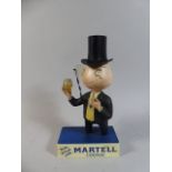 A Martel Cognac Advertising Figure.