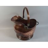 A Copper Helmet Shaped Coal Scuttle.