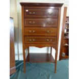 An Edwardian String Inlaid Mahogany Four Drawer Music Cabinet with Stretcher Shelf on Tapering