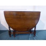 An Oak Oval Drop Leaf Barley Twist Gate Leg Dining Table.