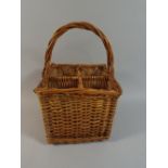 A Wicker Four Bottle Carrying Basket.