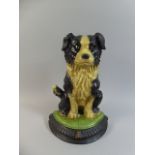 A Reproduction Cast Metal Door Stop in the Form of a Dog, 34cm high,