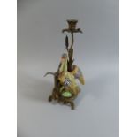 A Continental Ceramic and Ormolu Candle Stick in the Form of a Bird In Bullrushes,