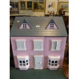 A Modern Dolls House with Furniture and Figures,