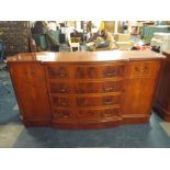 A Modern Break Fronted Cherry Wood Sideboard with Four Centre Drawers Flanked by Two Cupboards,