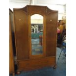 An Edwardian Oak Double Wardrobe with Mirror Door and Drawer to Base,