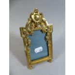 A French Gilt Brass Easel Back Photo Frame with Ornate Moulded Decoration,