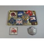 A Collection of Nine Various Car Badges