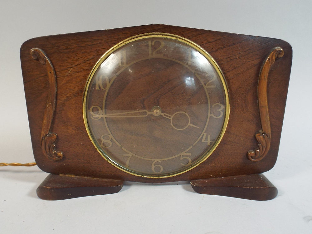 An Art Deco Walnut Electric Mantle Clock by Smiths,