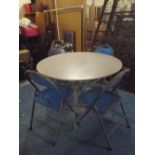 Four Folding Metal Garden Chairs and a Circular Patio Table