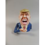 A Cast Metal Novelty American Money Bank in the Form of President Donald Trump,