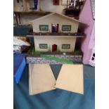 A Swiss Chalet Dolls House with Furniture,