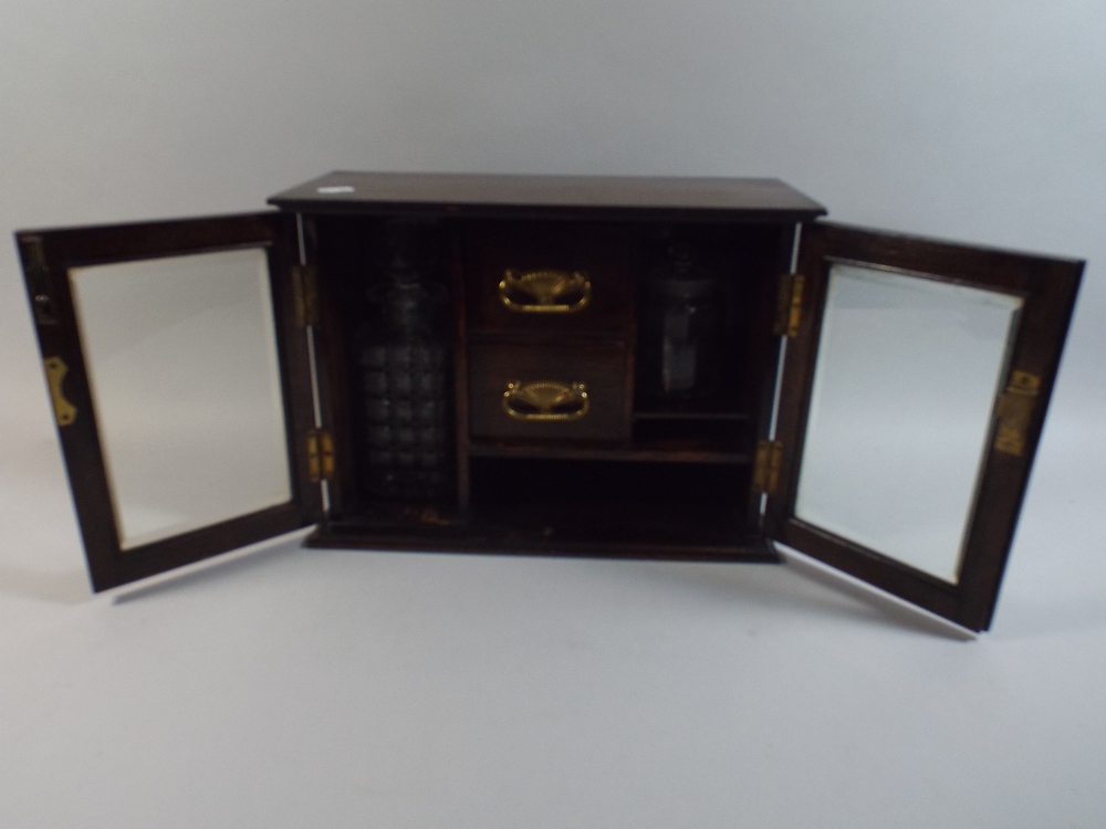 An Edwardian Oak Fitted Box Containing Glass Spirit Decanter and Tobacco Jar,