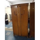 An Oak And Walnut Double Fitted Wardrobe with Compartments for Shirts Etc