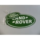 Two Reproduction Cast Metal Oval Landrover Signs, Largest 34cm Wide,