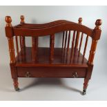 A Reproduction Mahogany Canterbury with Base Drawer and Brass Castors,