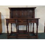 A 19th Century Oak Side Serving Table Formed From a Gate Legged Table with Raised Panelled Back,