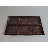 A Rectangular Patinated Copper Tray Decorated in Six Sections with Various Orchids,